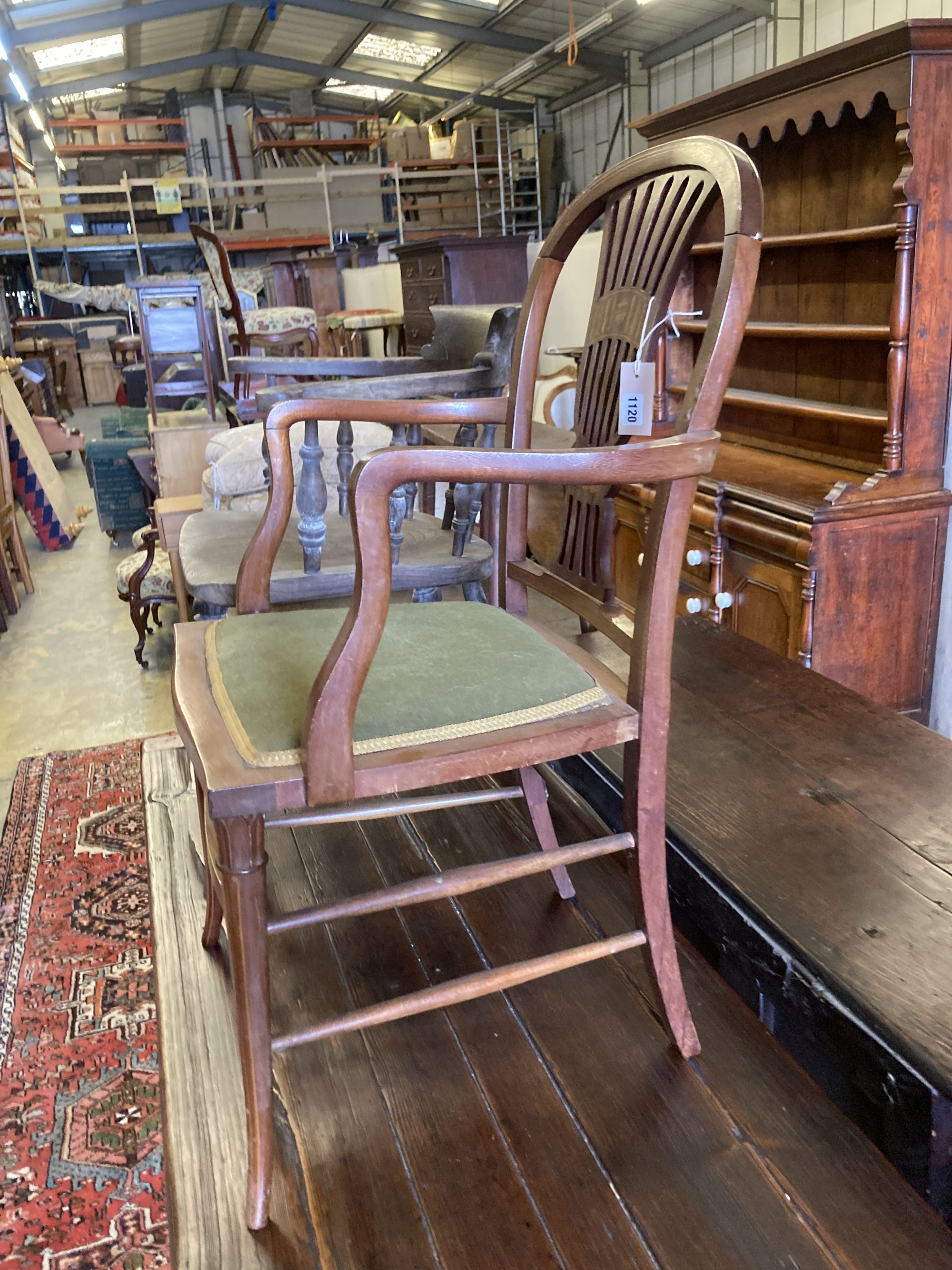 A Victorian bleached elm and ash smokers bow chair and an Edwardian inlaid mahogany elbow chair (2)